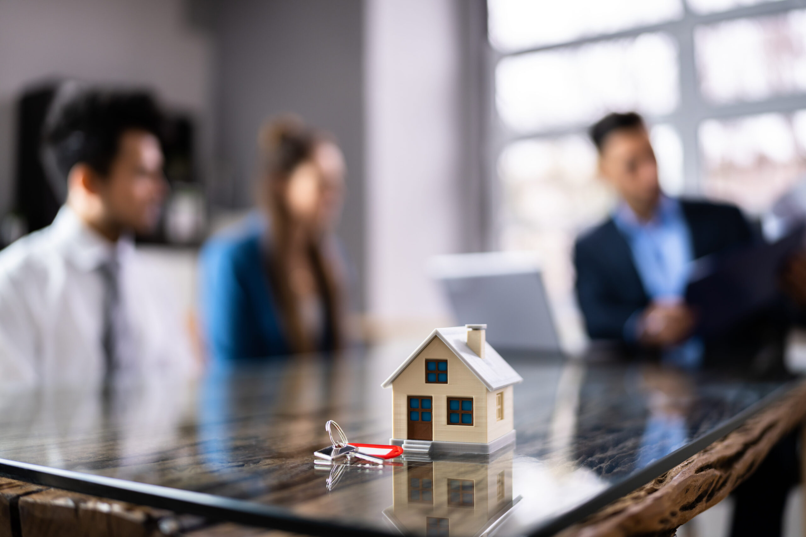 DFW real estate model home with keys, representing property search and homeownership.